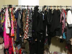 A rack of many different kinds of clothes