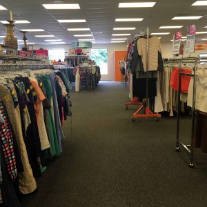 A picture of the interior of the Waldorf Goodwill of Greater Washington location with racks of clothing throughout the shot