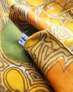 A close up of the yellow patterned napkins