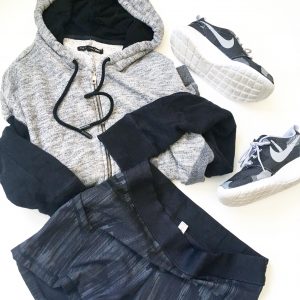 A picture of three items: a size medium, comfy, soft gray and black, paneled hoodie by Rag and Boone, stretchy, elastic, black Lululemon fitness mini running shorts in a size 8, and a pair of Nike, grey, black, and white monochromatic running shoes