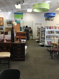 The furniture and books and media section of the Alexandria Goodwill of Greater Washington retail store