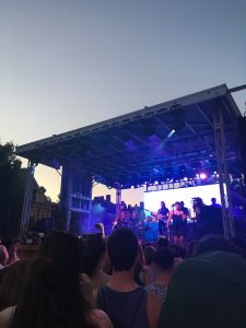 A picture of a stage at the Sweetlife Sweetgreen Block party. The band Blood Oranged is playing