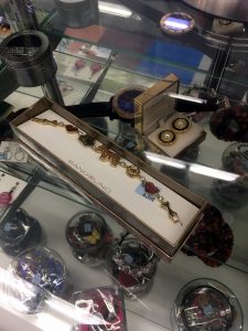 A picture of the jewelry case at the Centreville VA Goodwill retail store with various necklaces, earrings, and bracelets in it