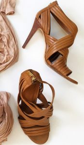 A picture of the strappy, tan, authentic Tory Burch heels in a size 7.5