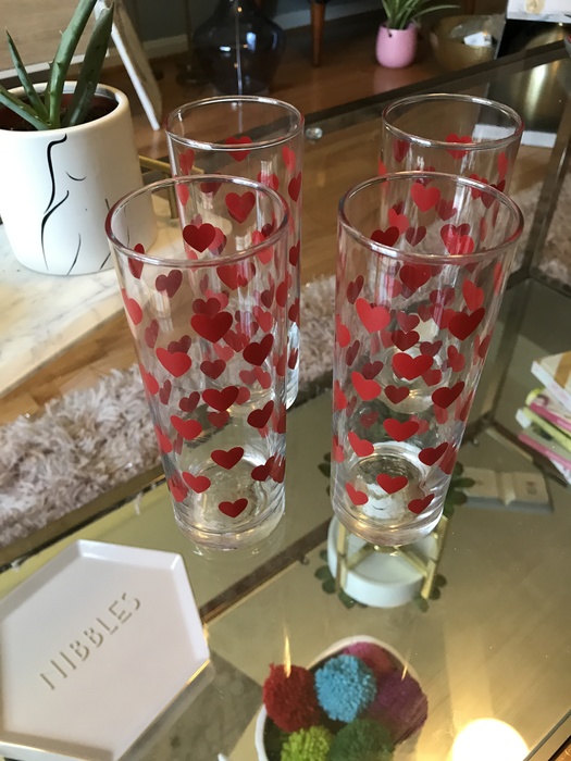 A set of four heart glasses purchased at Goodwill