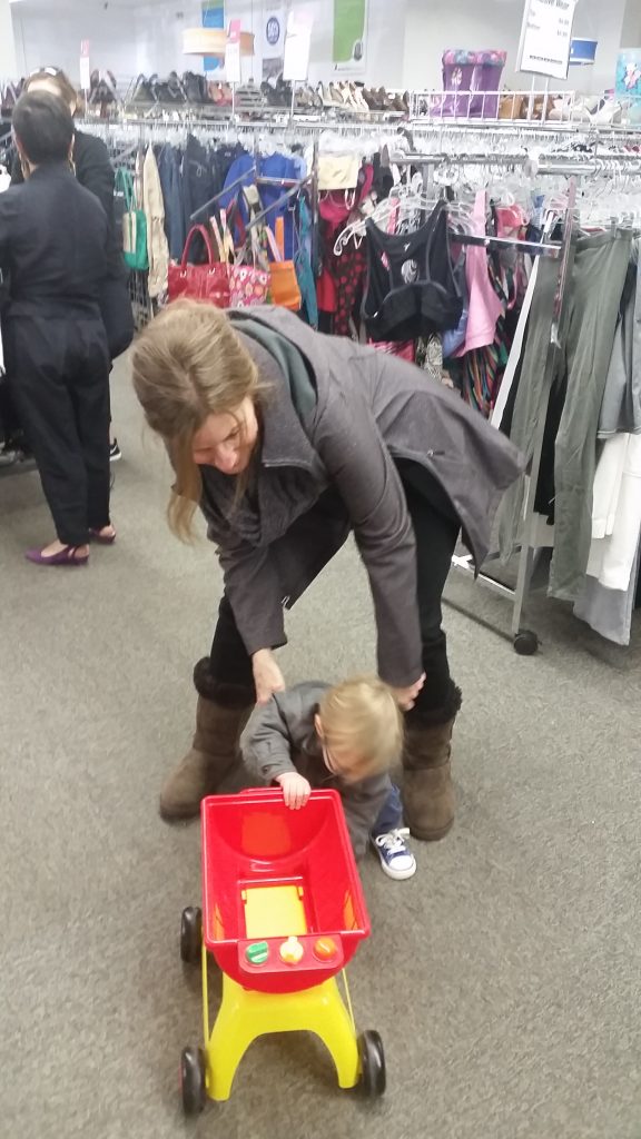 Meetup shopper and child play with toy found at South Dakota Goodwill