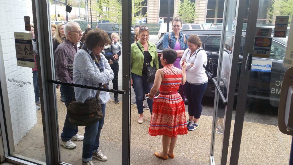 Carolyn greets shoppers at Columbia Pike Meetup