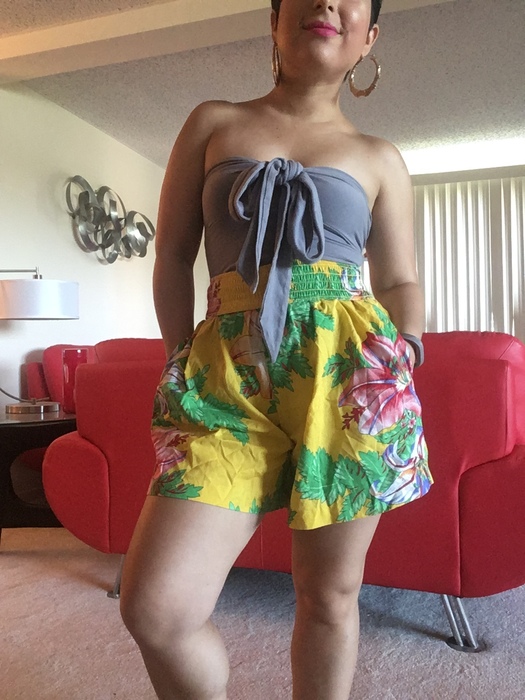 Carolyn models her beach outfit featuring vintage floral shorts from Goodwill.