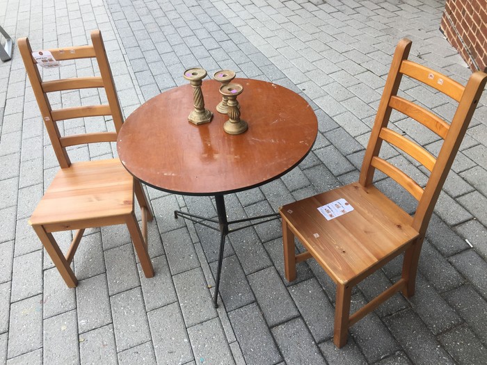 Tim's candle sticks, table, and chairs found at Goodwill store