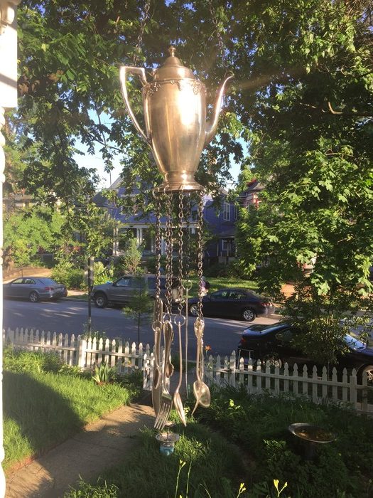 Tim's completed teapot wind chime hanging from his porch