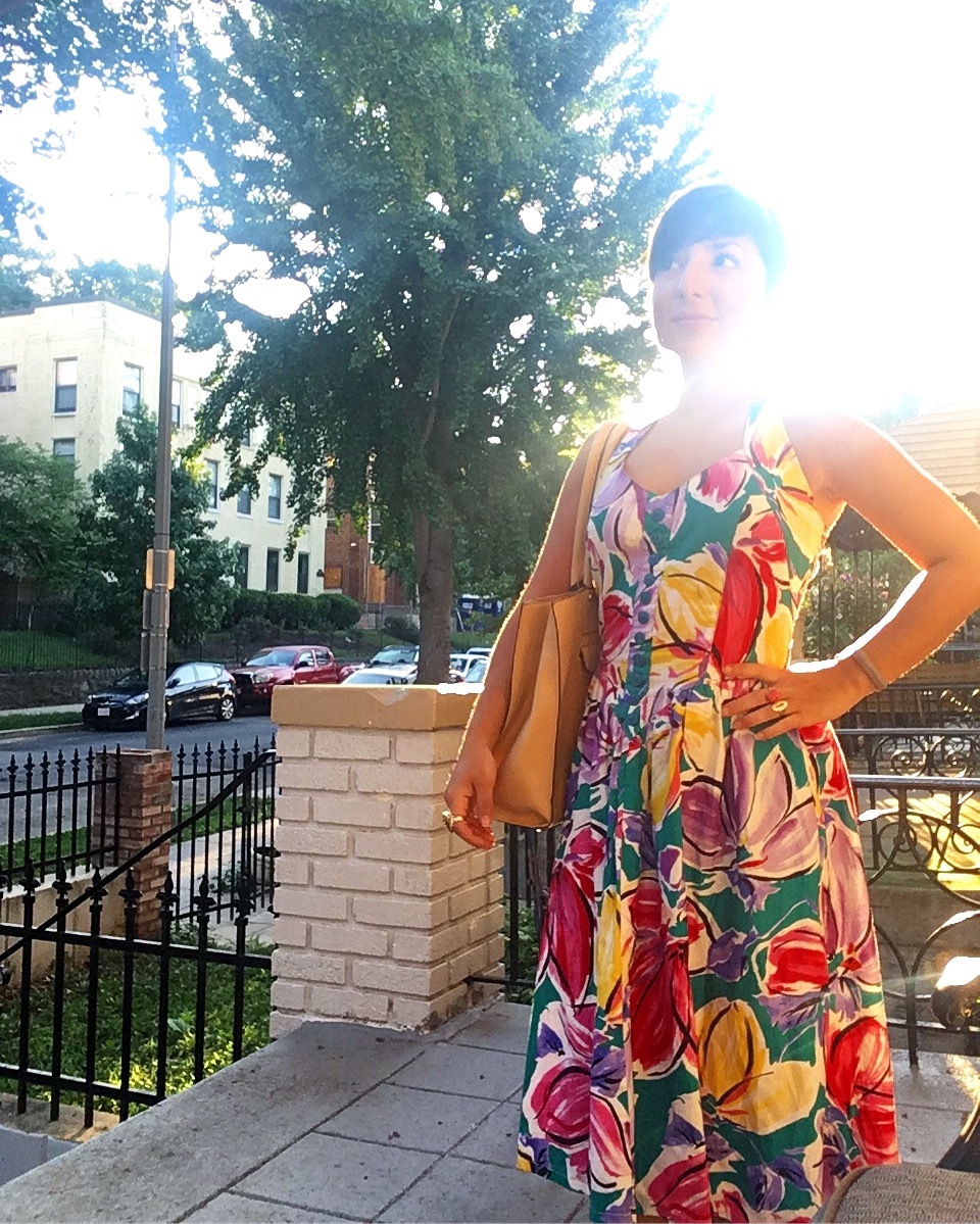 Carolyn poses in a colorful vintage dress