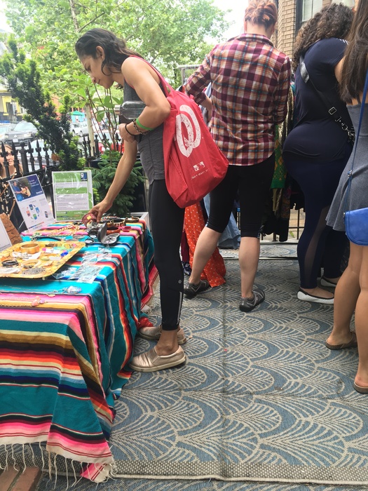 Shoppers perusing Goodwill items at vintage pop-up