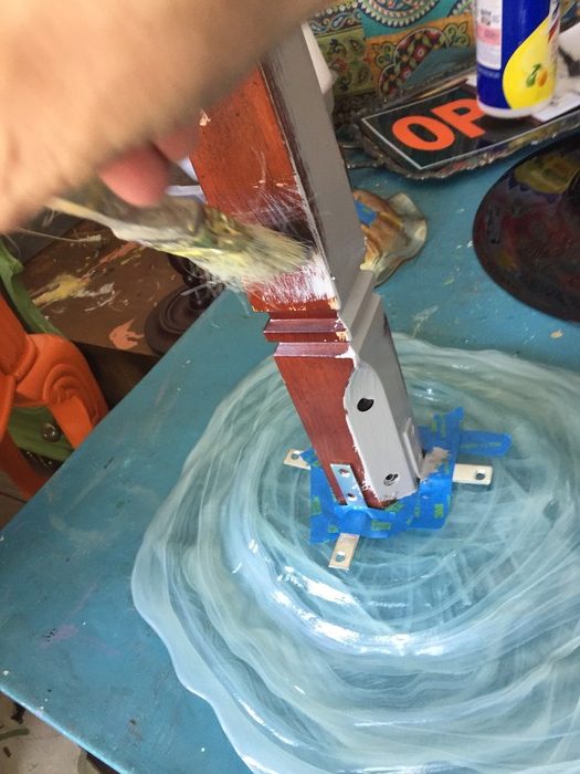 Tim begins to paint the base of the bird bath