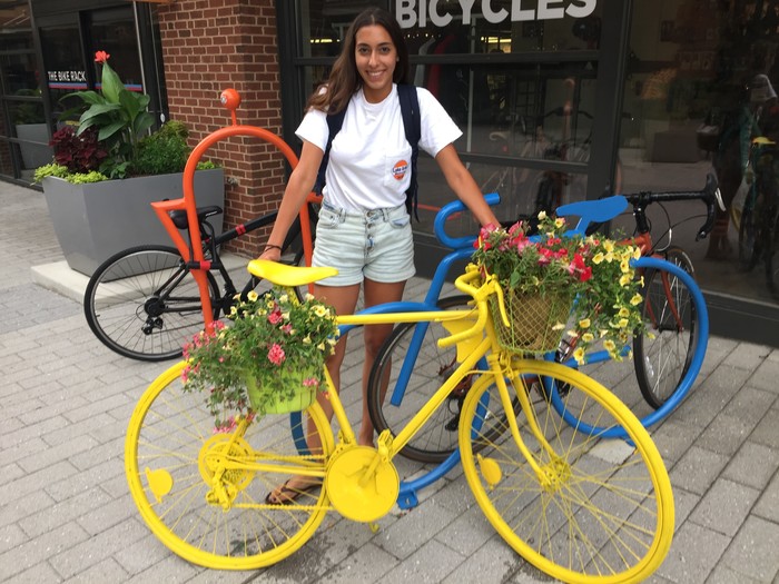 Tim's friend stands with completed bicycle planter