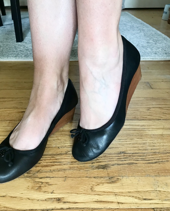 Karen wears her pair of Tory Burch wedges found at Goodwill