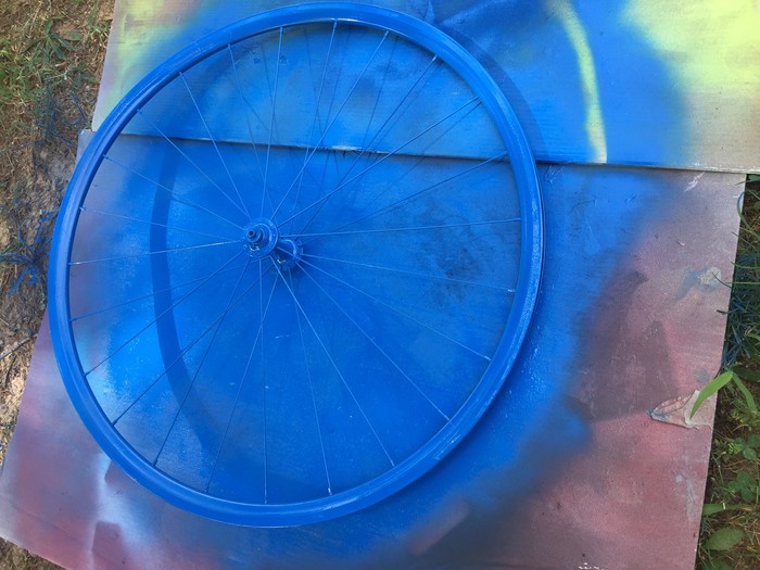 Tim's bicycle wheel spray painted blue
