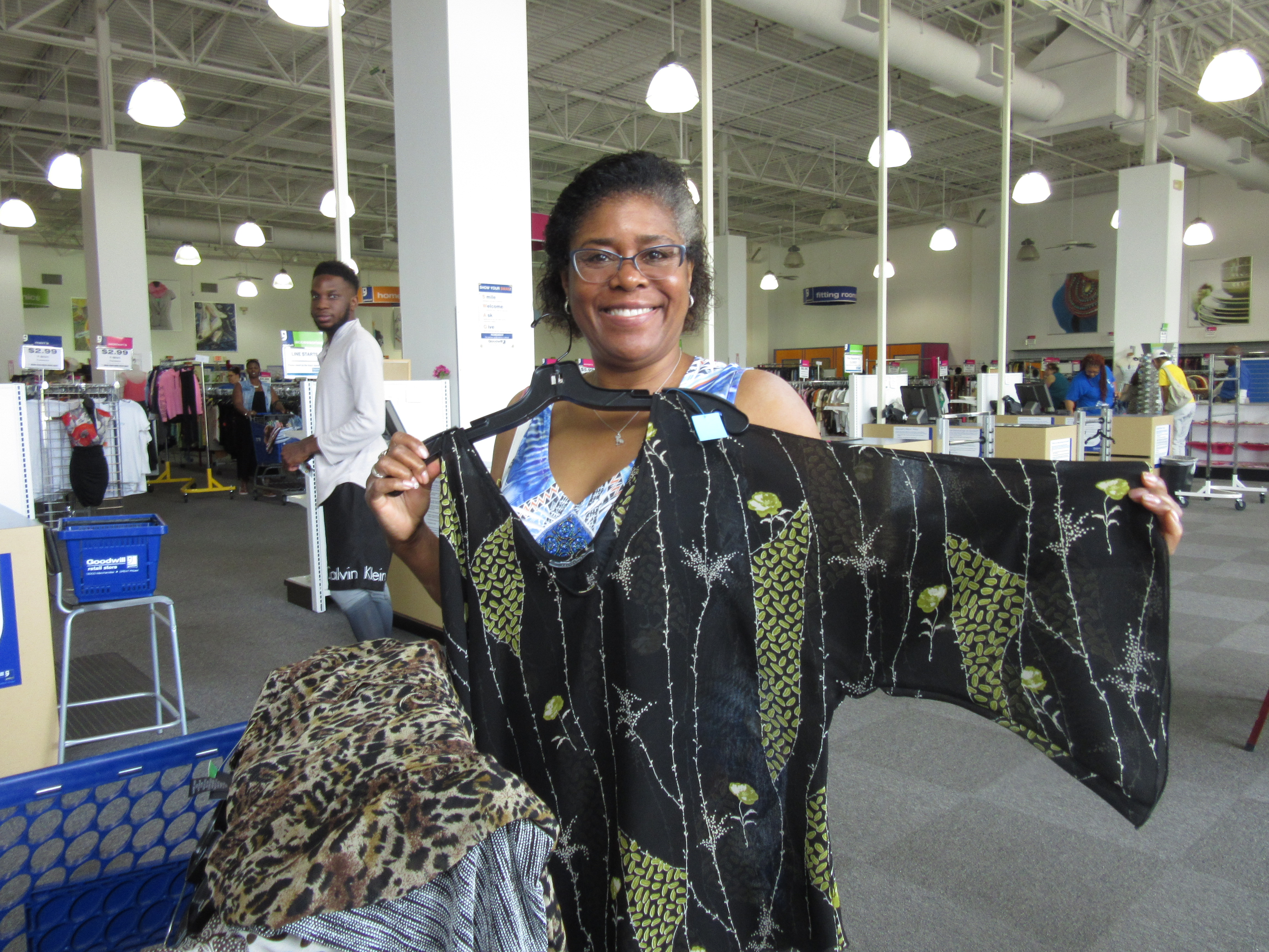 Meetup shopper poses with a blouse at the Bowie, MD Goodwill
