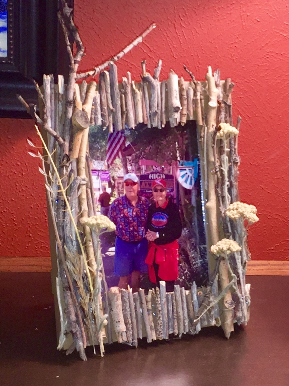 Tim displays a photo in his completed memento frame.