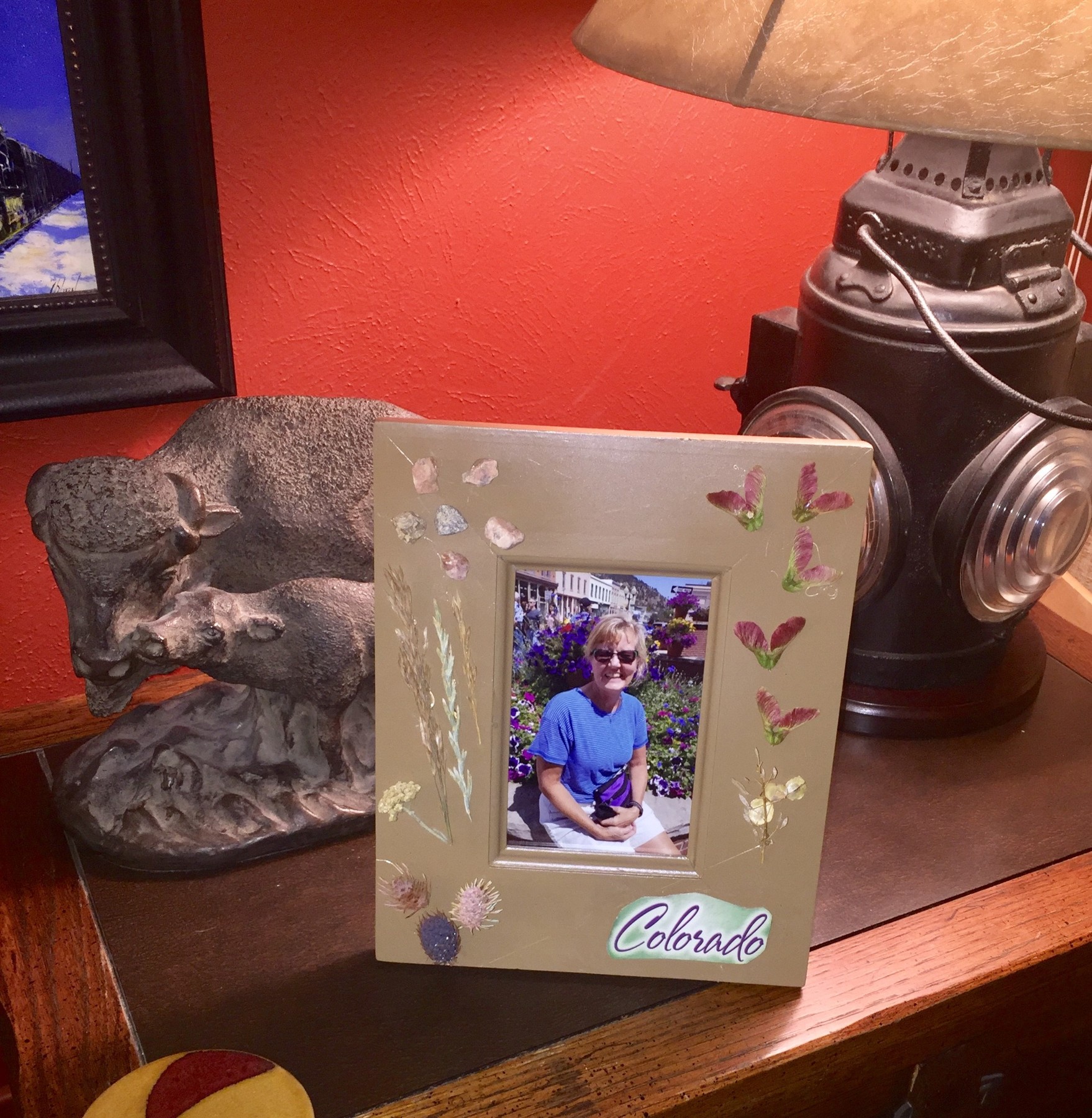 Tim displays a photo in his completed memento frame.