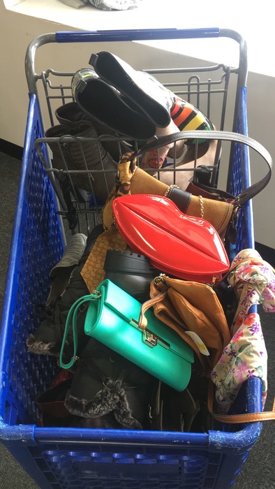 Meetup shopper's cart full of purses