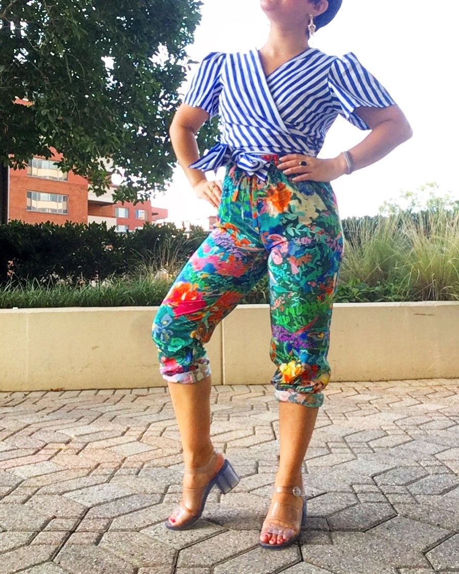 Carolyn styles her mixed pattern outfit with basic gold jewelry and clear jelly sandals.