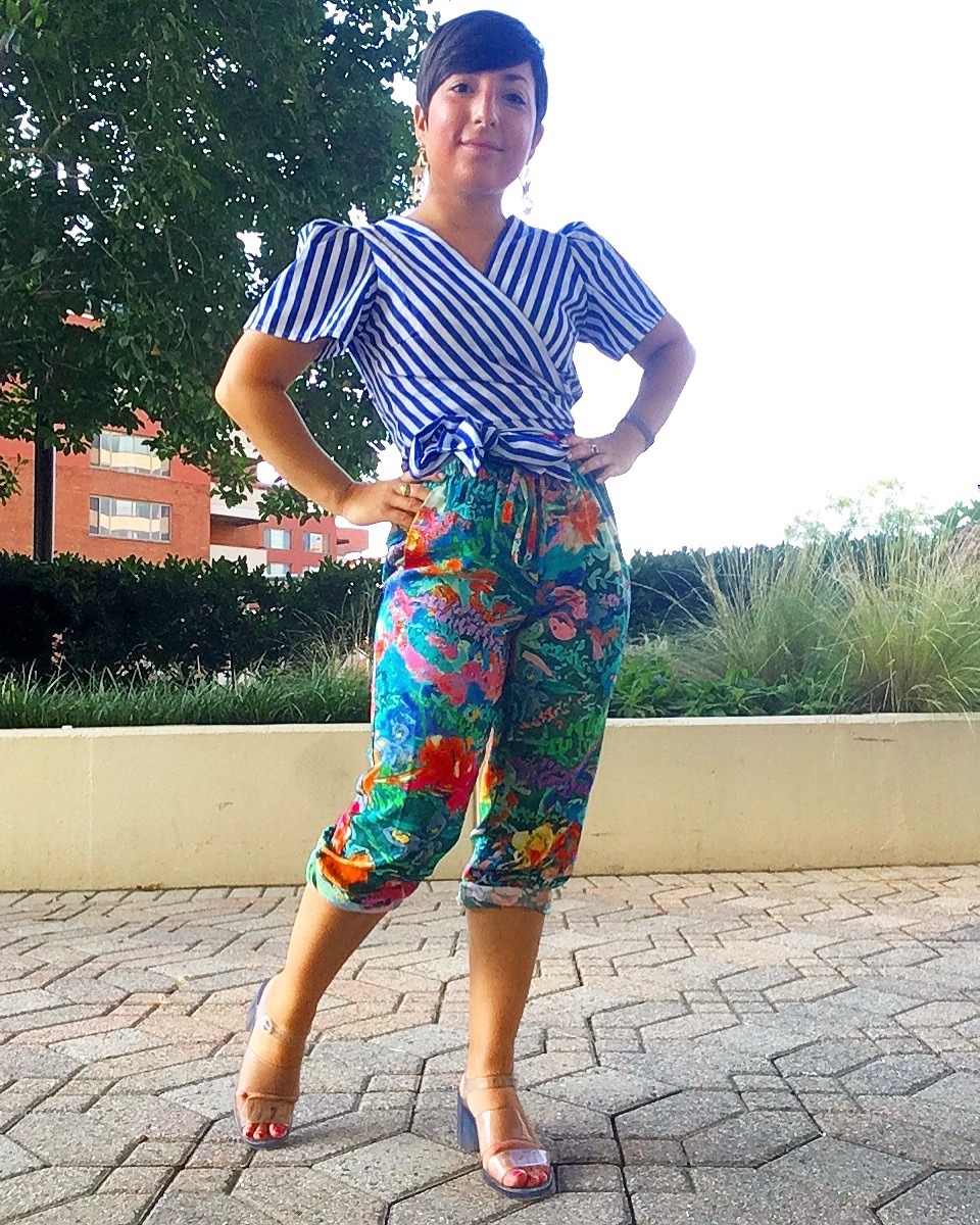 Carolyn pairs watercolor capris with a blue striped wrap blouse.