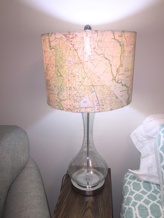 Tim's upcycled lamp placed on a bedside table