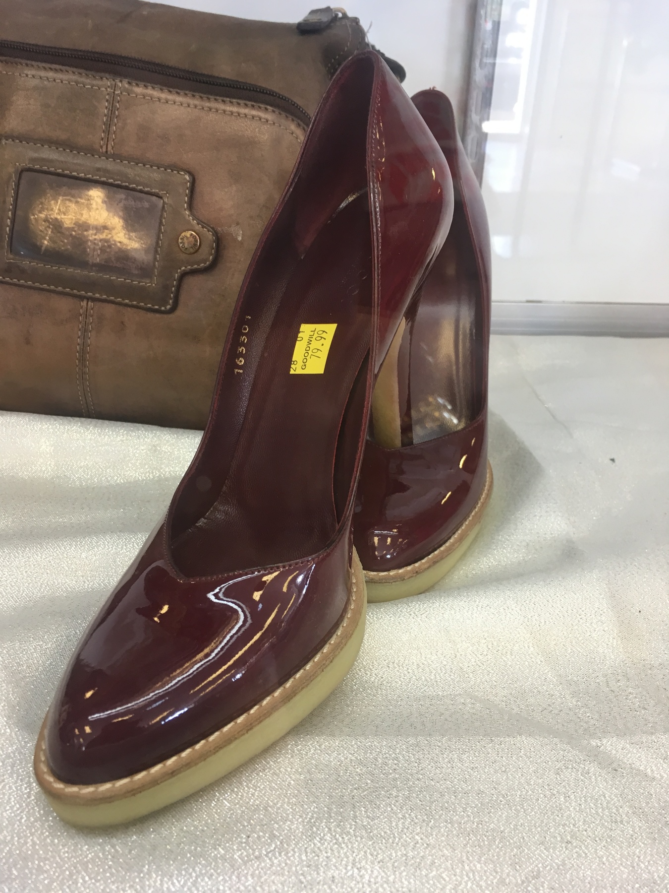 burgundy Gucci pumps found at Waldorf Goodwill