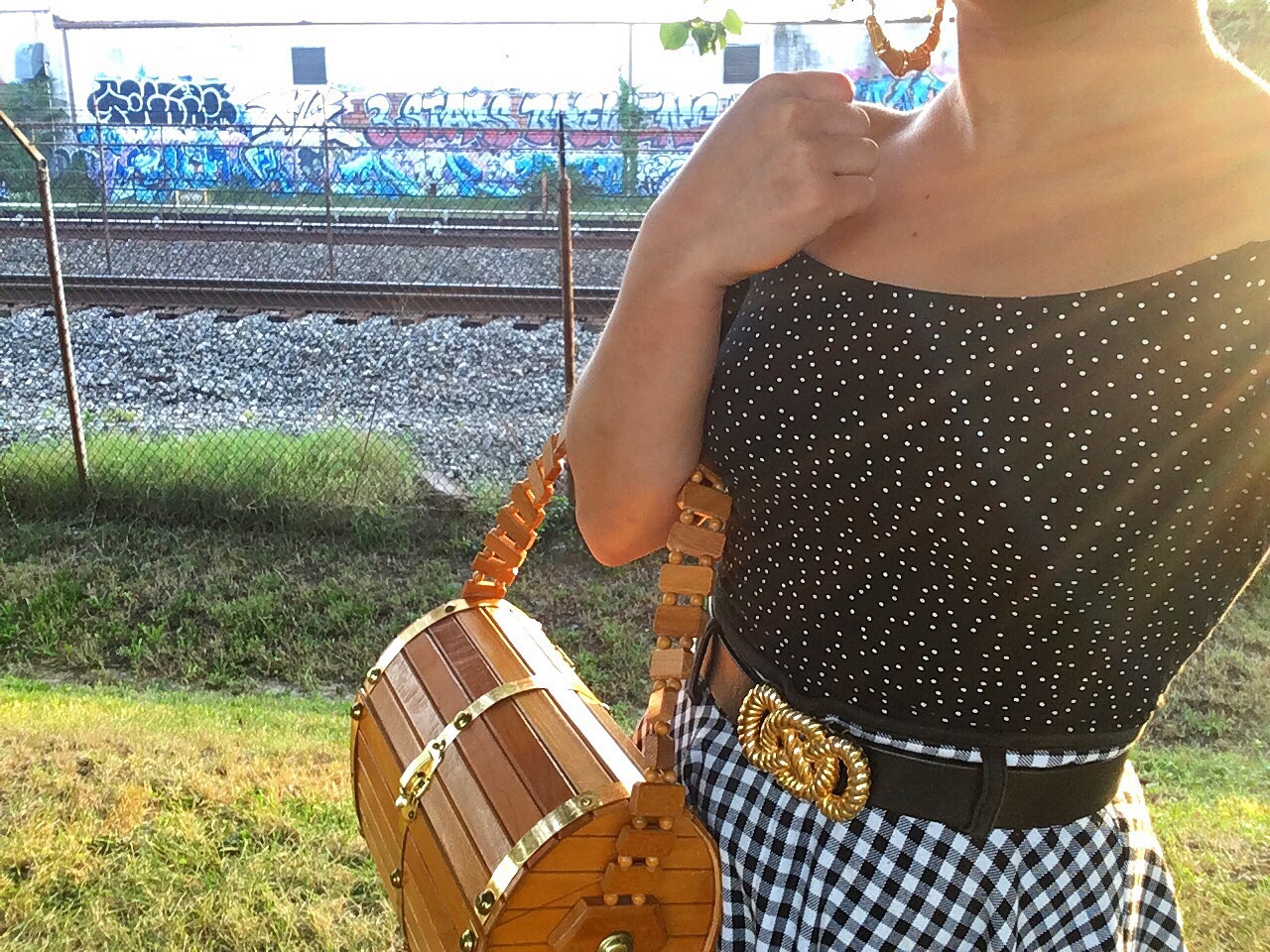 Carolyn's summer outfit of a gingham skirt and spotted crop top