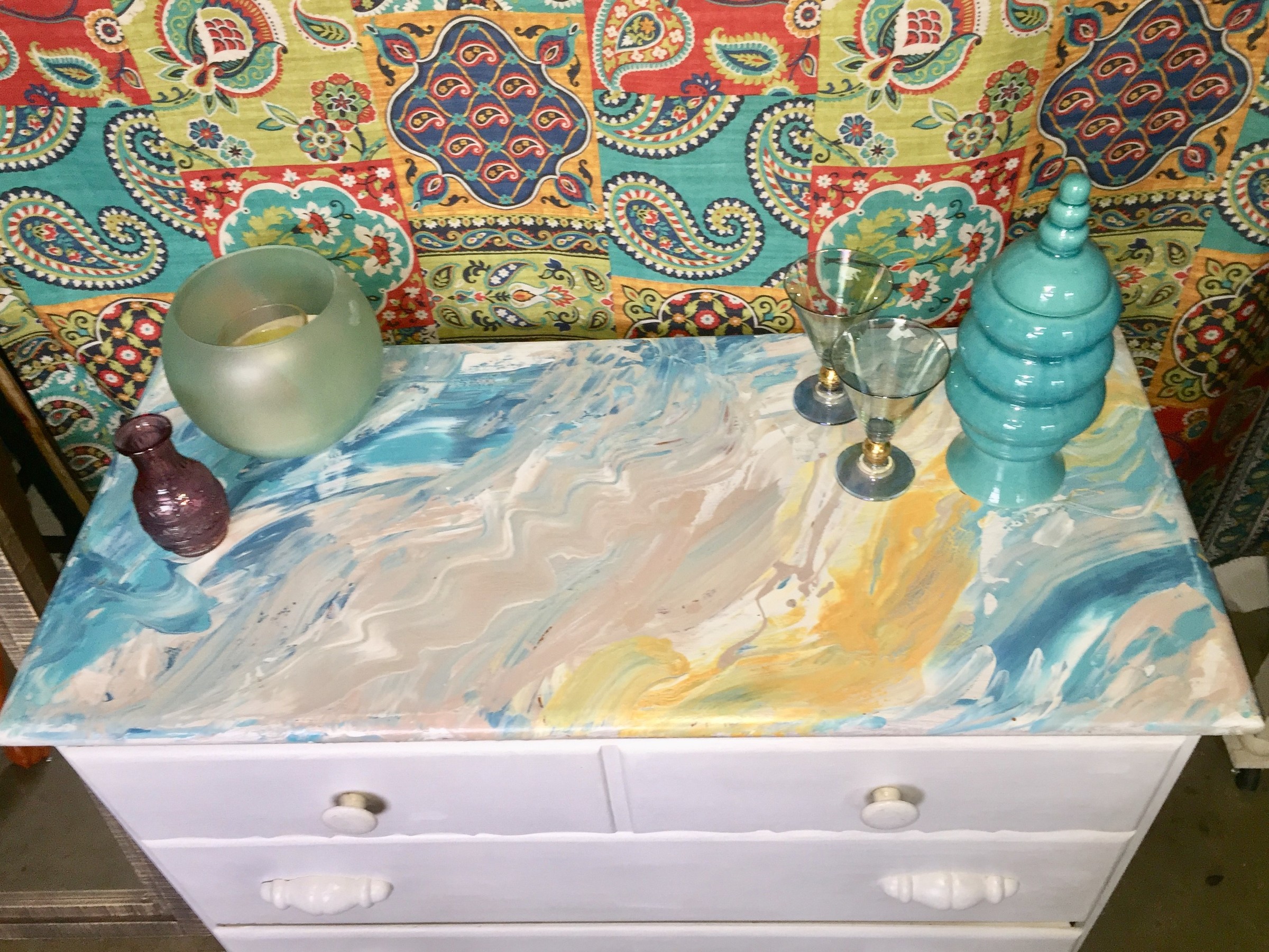 Tim's painted dresser adorned with stylish accessories