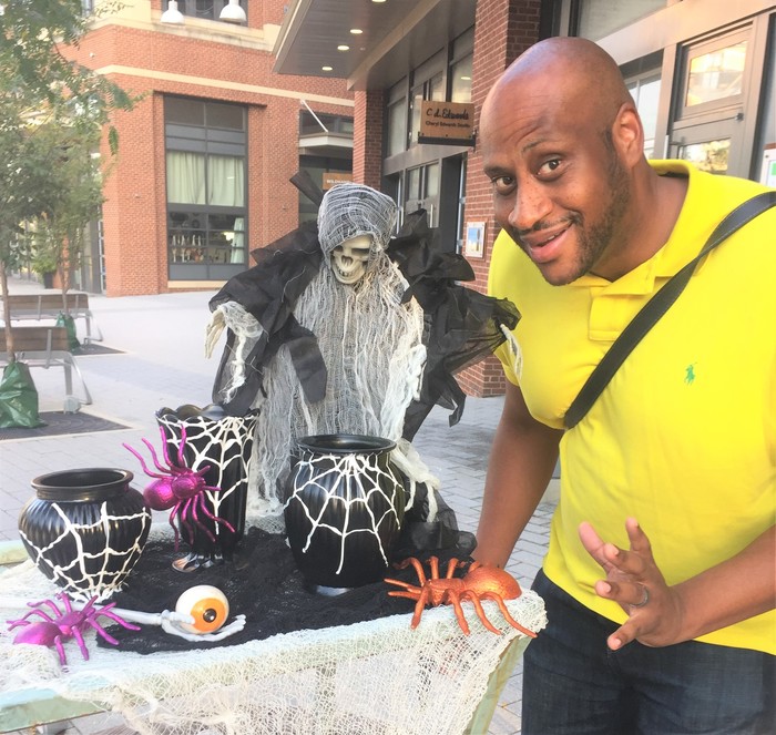 Tim's friend strikes a spooky pose next to Halloween table scape