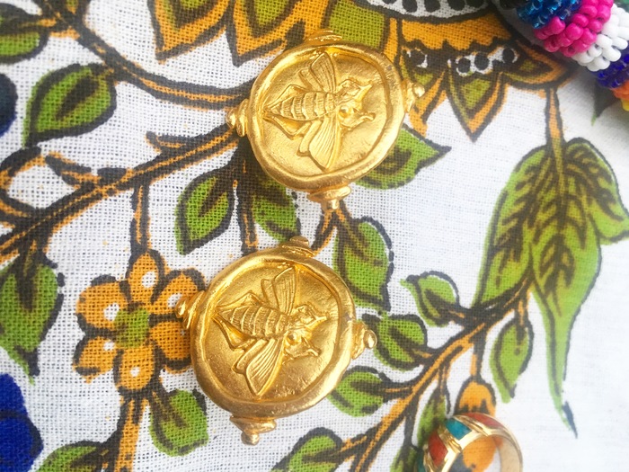 Carolyn's gold earrings found at Goodwill