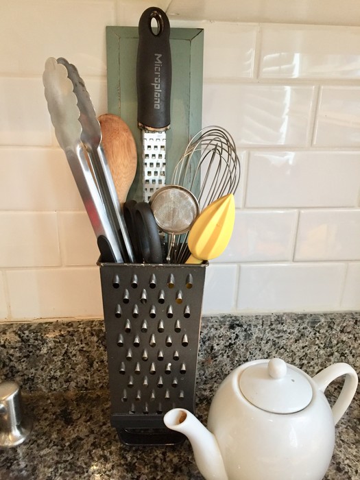 Tim's upcycled grater used to hold cooking utensils