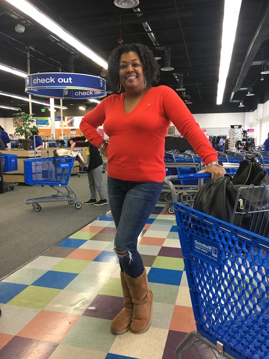 Meetup shopper models a red Lacoste sweater during the Sully Station meet up