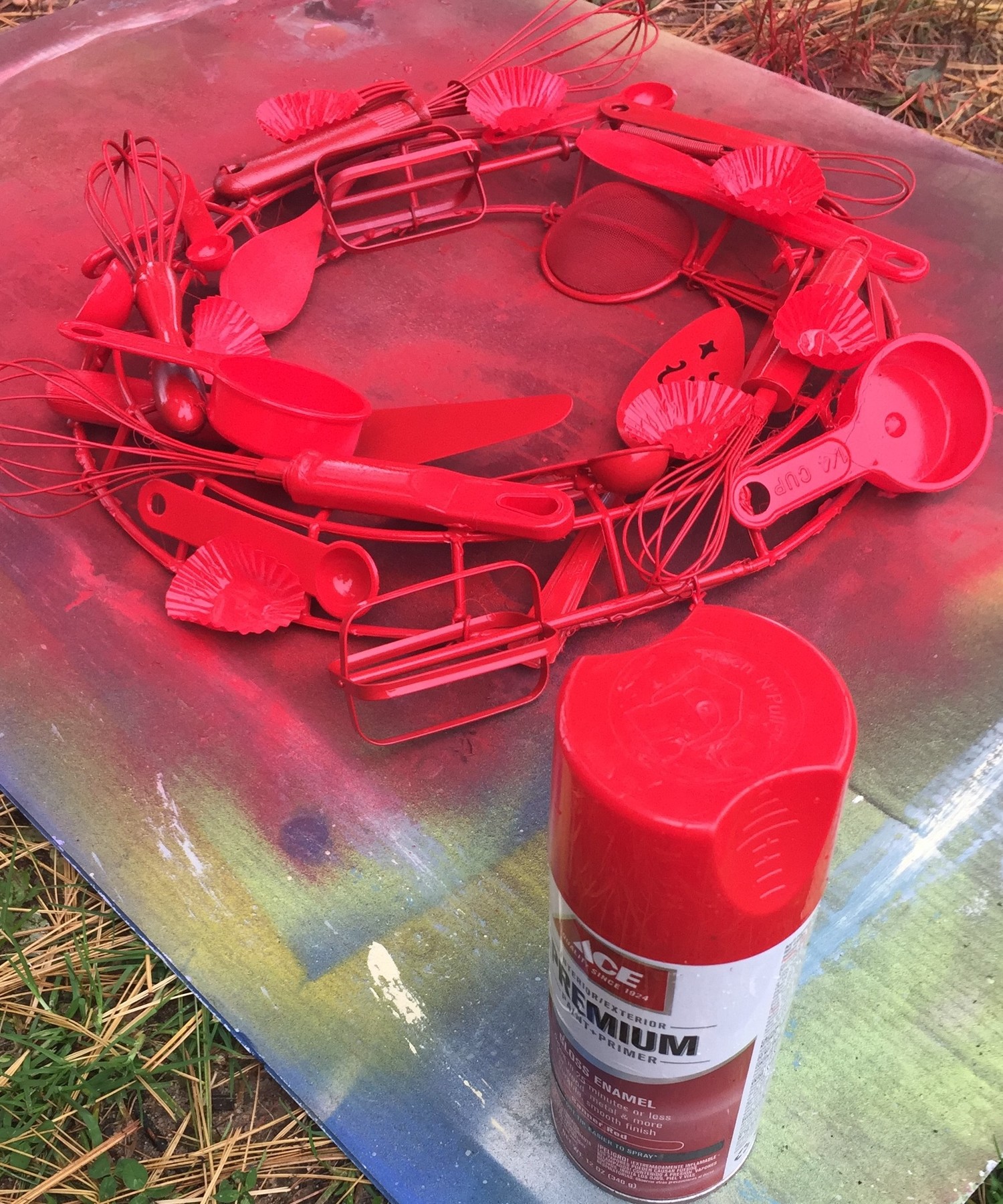 Tim's utensil wreath spray painted red.