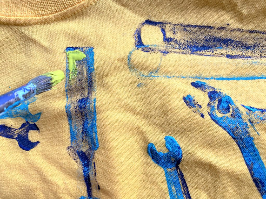 https://findingyourgood.org/wp-content/uploads/2020/06/Goodwill-blog-tool-stamps-yellow-shirt-adding-detail-1024x768.jpg