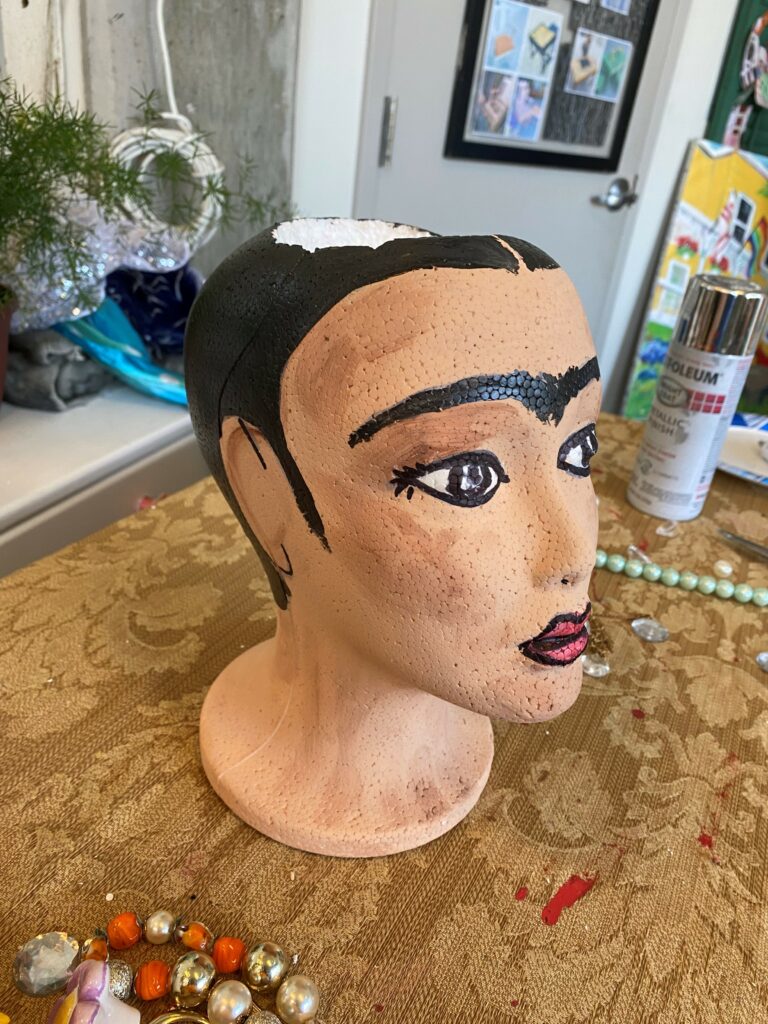 So, I got a bunch of foam heads for my wigs, and I painted this